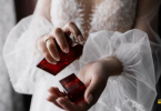 Bride spraying perfume on her wrist to check the Smell