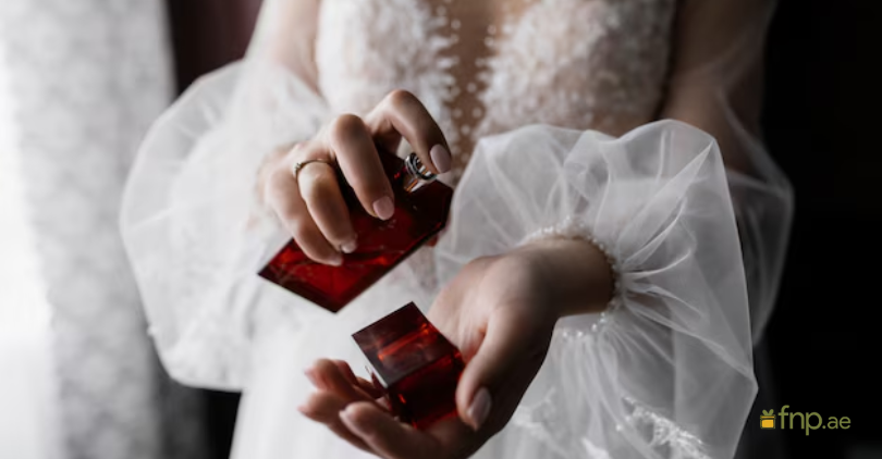 Bride spraying perfume on her wrist to check the Smell