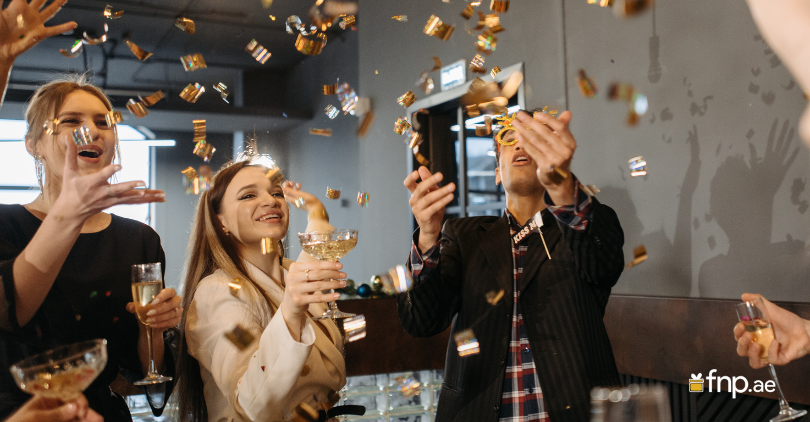 Group of friends enjoying New Year's Eve party with joy and excitement