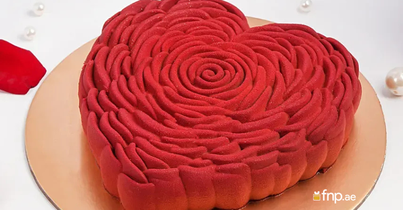 Sweet Red Heart-Shaped Cake Placed on Table