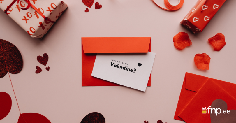 red color Will you be my Valentine card on desk