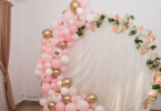 A beautiful Balloon arch made with pink, white and golden color