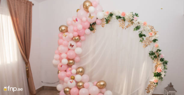 A beautiful Balloon arch made with pink, white and golden color