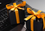 Corporate gift boxes kept on laptop