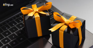 Corporate gift boxes kept on laptop