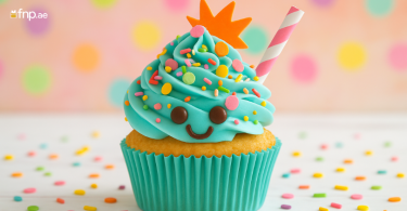 A blue cupcakes with smile choco face