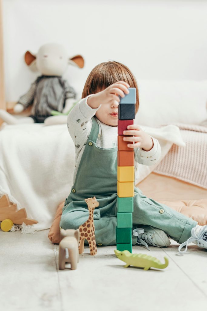 Small boy building lego blocks