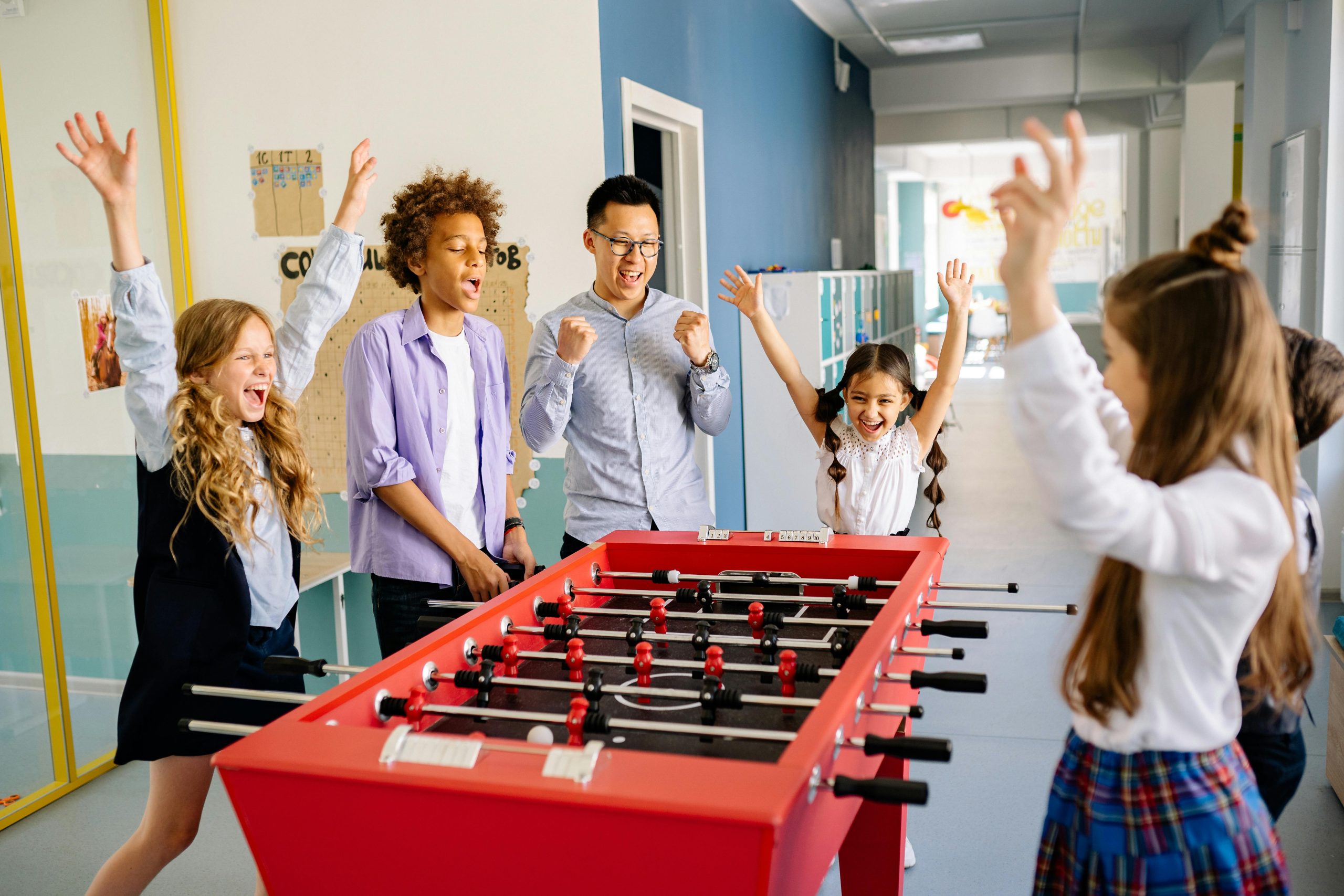 Teacher Playing games with his students in school