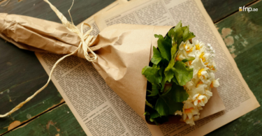 Flower Bouquet Wrapped in gift paper tied with ribbon