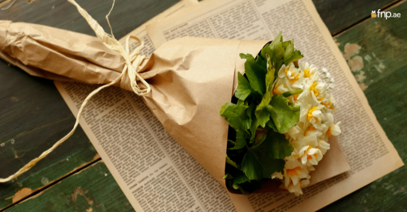 Flower Bouquet Wrapped in gift paper tied with ribbon