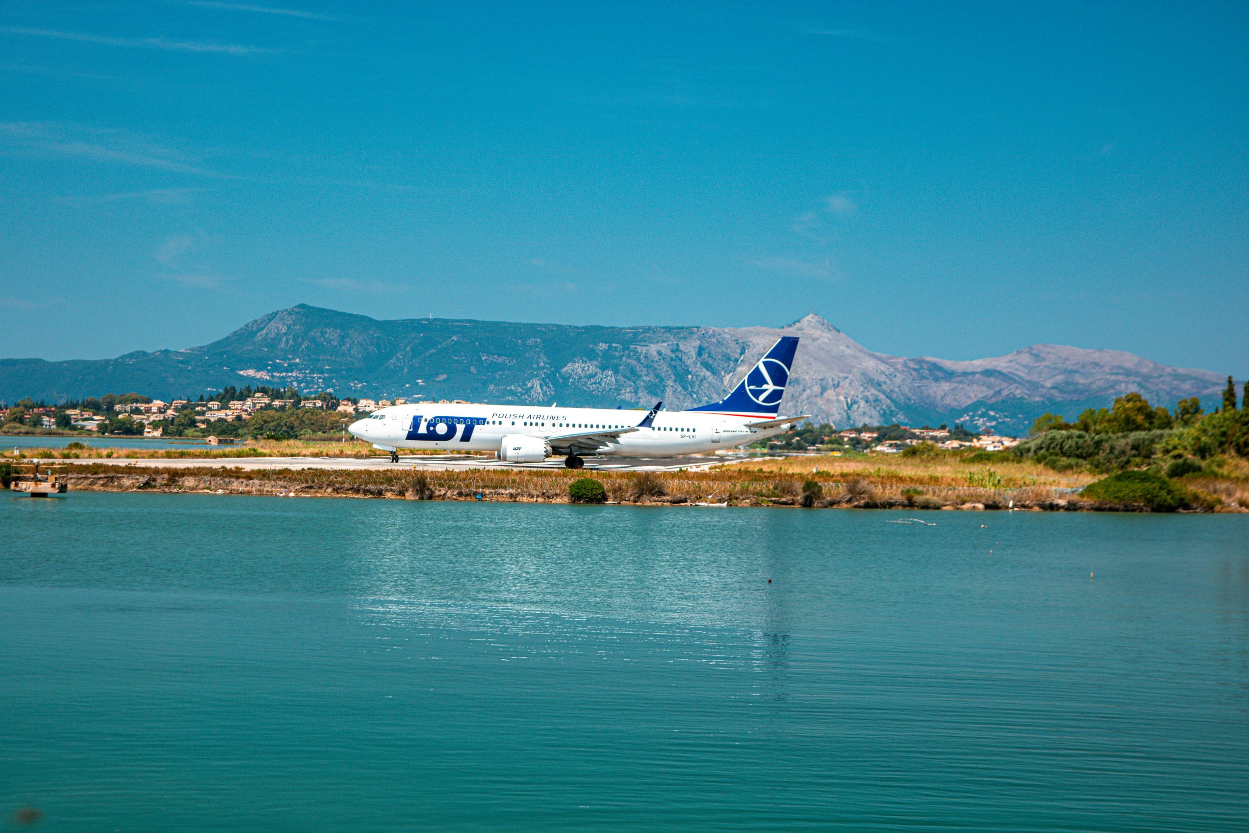 An Aeroplane flying passing the river