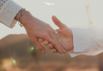 Couple holding each other's hands while proposing