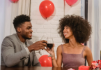Couple enjoying drink at home on valentine's day
