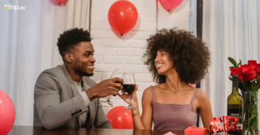 Couple enjoying drink at home on valentine's day