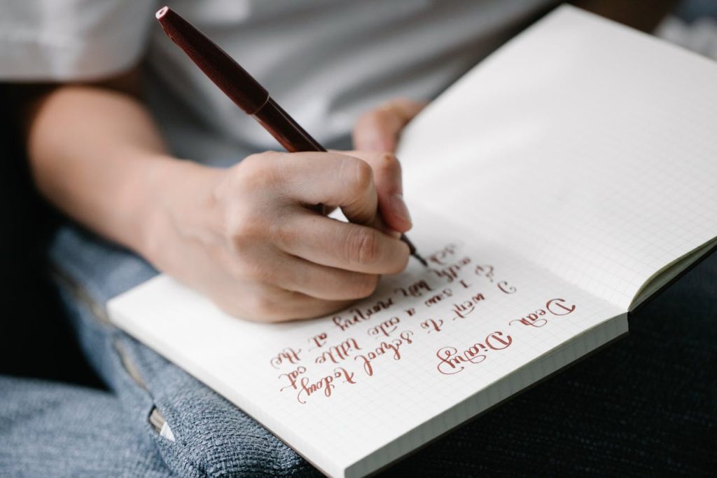 Woman journaling to reflect on her thoughts