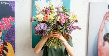 Person holding beautiful flower bouquet in their hand as a sorry gesture