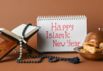 Islamic New Year wish written on Diary that is kept alongside holy book