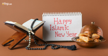 Islamic New Year wish written on Diary that is kept alongside holy book