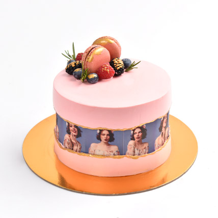 Pink cake with girl image on it like a vintage reel strip