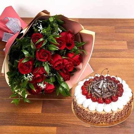 Black forest cake with red roses bouquet