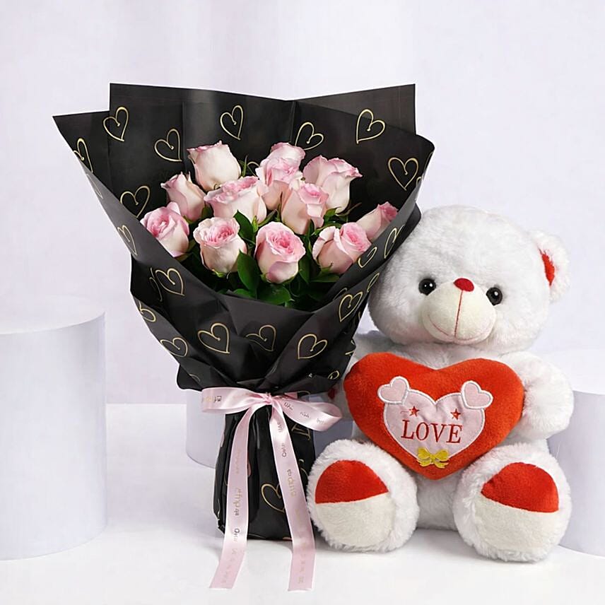 Love and Cuddles Teddy Bear with 12 Pink Roses: Valentines Day Gifts to Bahrain