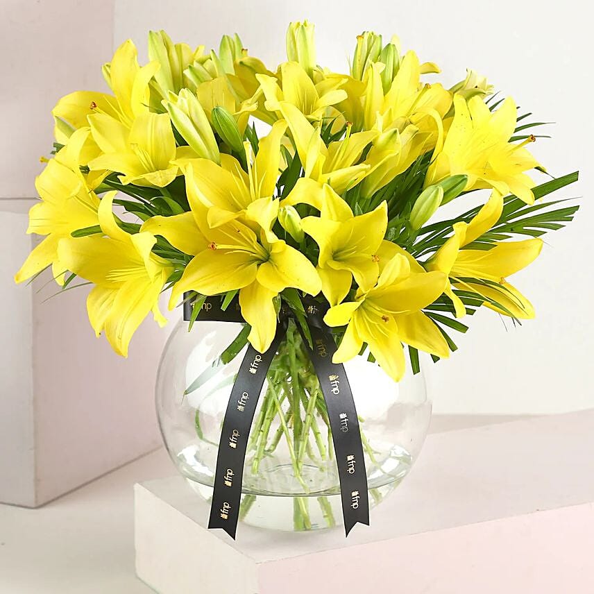 Cheerful Yellow Lilies In Fishbowl Vase: Flower Delivery to India