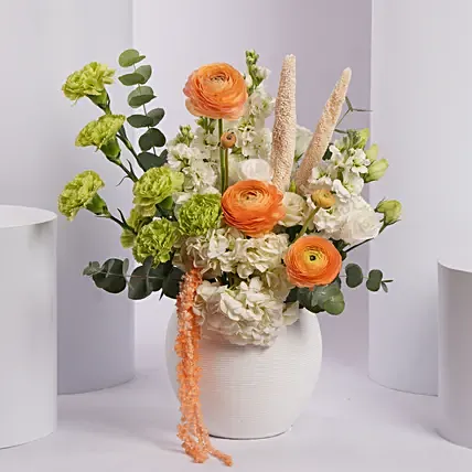 Vibrant Orange and Green Flower Arrangement in White Vase: 