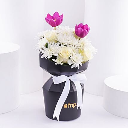 White Flowers Beauty N Tulips Bouquet: Send Anniversary Gifts to Saudi Arabia