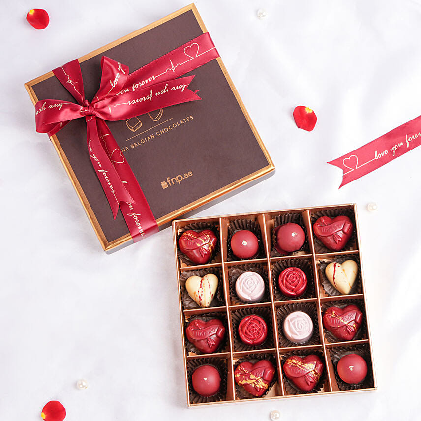 Assorted box of Belgian Chocolate beautifully wrapped in red ribbon by fnp.ae